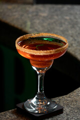 delicious cocktail on bar counter. The barman is making cocktails in the nightclub. Cocktail with vodka, rum, tequila, orange liqueur, classic cocktail menu, basic cocktails.