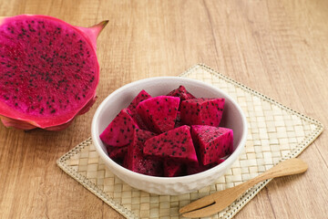 Sliced Red ​​Dragon Fruit ( Buah Naga Potong) served in a bowl
