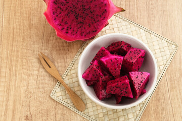 Sliced Red ​​Dragon Fruit ( Buah Naga Potong) served in a bowl
