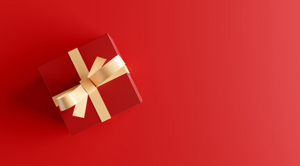 Red gift box with white ribbon on red background with copy space.