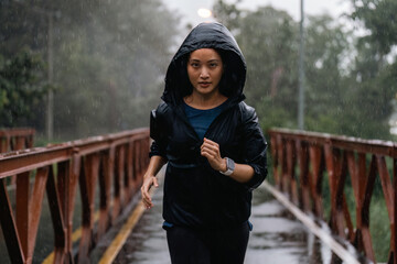 Asian ladies running in the rain