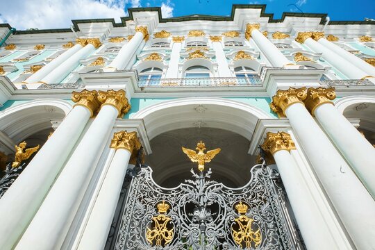 St. Petersburg, Russia - May 27, 2021: The main gate of the Winter Palace or the Hermitage. The wrought-iron door and the symbol is a double-headed eagle.