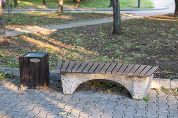 Wooden gray bench in the city park