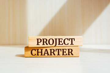 Wooden blocks with words 'Project charter'. Business concept