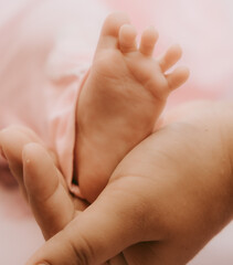 baby feet in a hand