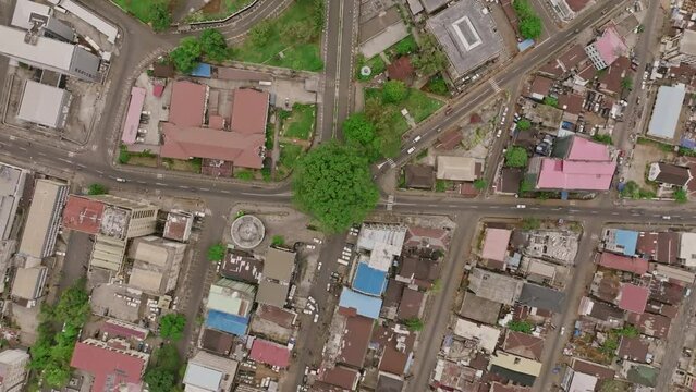 Aerial top down footage of the Cotton Tree in downtown Freetown, Sierra Leone.
