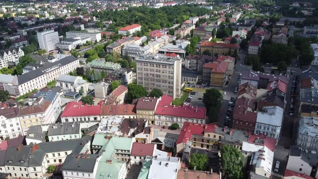 Chemical plant Grupa Azoty and historic City Hall and Museum (Muzeum Ratusz) on the old town main square (Rynek Gł&oacute;wny) in Tarn&oacute;w, Poland - 4K 30FPS Panning Up
