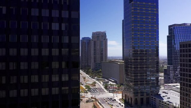 Aerial dolly panning shot around skyscraper to reveal Century City, California. HD at 60 FPS