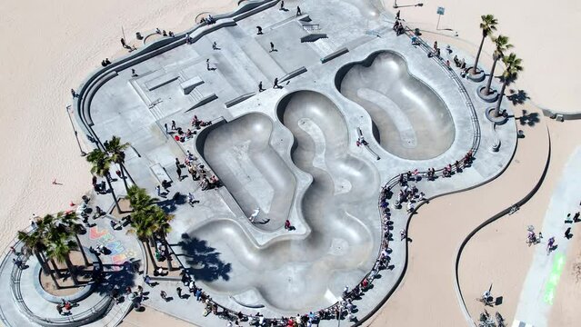 Orbiting aerial view of Venice Skate Park and beach area - venue of the 2028 Olympic freestyle event