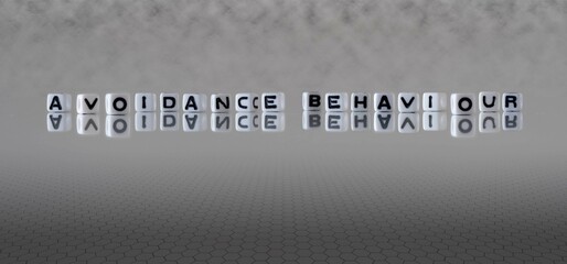 avoidance behaviour word or concept represented by black and white letter cubes on a grey horizon background stretching to infinity