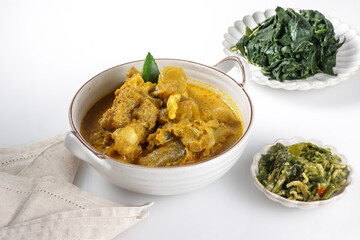 Gulai Tunjang or Kikil or Gulai Kaki Sapi is a popular spicy cow's trotter curry in Padang (West Sumatra-Indonesia) cuisine. Food preparation for the feast of Eid al-Fitr and Eid al-Adha