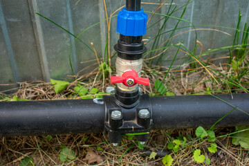Connection of plastic sewer pipes closeup. Irrigation system for vegetable garden concept
