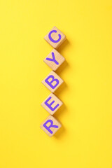 Wooden cubes with text Cyber on yellow background