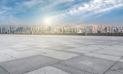 Empty floor tiles and city buildings background