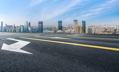 Empty road and city buildings background