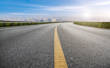 Empty road and city buildings background