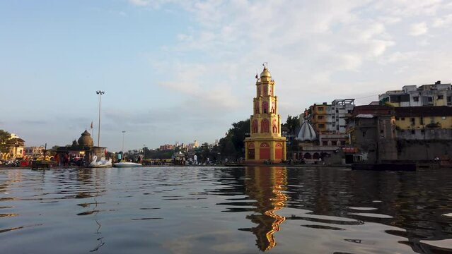 Sri Yashwant Maharaj Samadhi Hindu Temple With Reflection In Gandhi Sagar Lake, Ramkund, Nashik, India. - low level