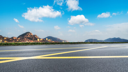 Empty road and city buildings background