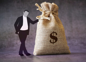 Business man standing with dollar bag stock photo