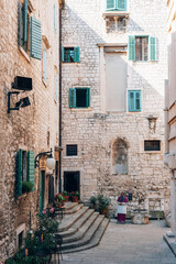 Old stone historic buildings of Sibenik, Croatia. Traditional Dalmatian old town architecture. Summer travel vacation concept