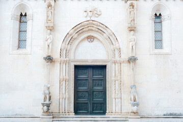 Fototapeta na wymiar Entrance to the cathedral of Saint James in Sibenik, Croatia