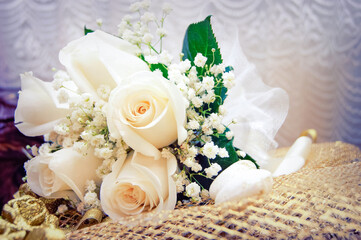 Wedding photo, wedding bouquet beige roses green leaves