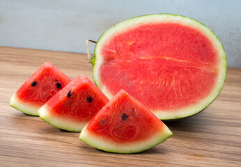Fresh sliced watermelon on brown wooden table