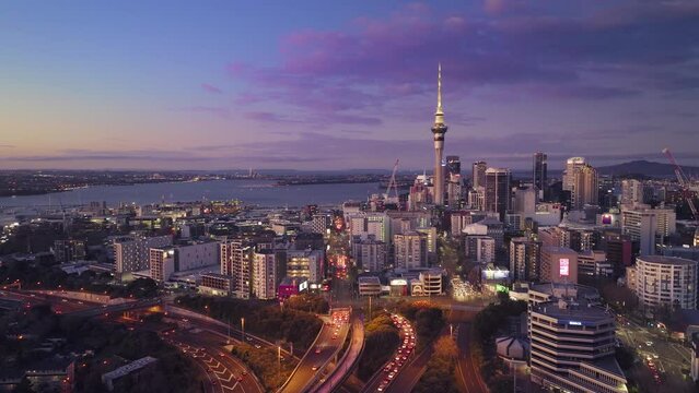 Aerial: Auckland city and commuter traffic at twilight