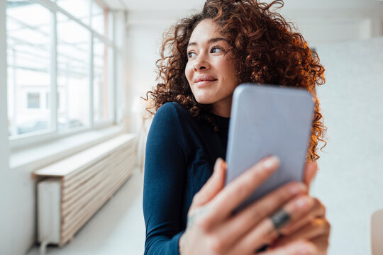 Smiling Beautiful Woman Taking Selfie Through Smart Phone