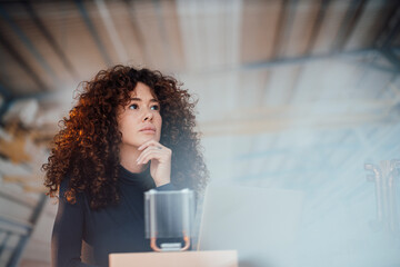 Thoughtful engineer with semiconductor at office
