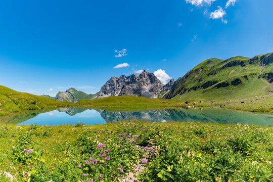 Mountains by lake Eissee on sunny day