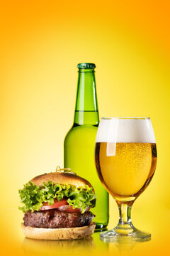 Beer glass, bottle and hamburger