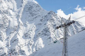 Cable car against the backdrop of the snow-capped Caucasus mountains, glacier seven