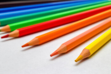 Many multicolored pencils isolated on a white background