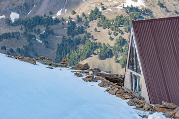 Husky dog sits on a terrace in the mountains