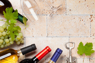 Various wine bottles, glasses and corkscrews