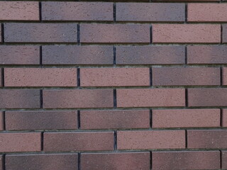 Obraz premium 細長い煉瓦色の横向きの長方形の壁のテクスチャー