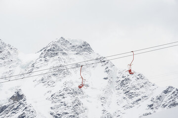 Cable car against the backdrop of the snow-capped Caucasus mountains, glacier seven