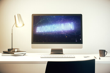 Modern computer monitor with blockchain technology hologram. Research and development decentralization software concept. 3D Rendering