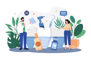 stomatologist doctor explains proper dental hygiene to the patient holding the sample.