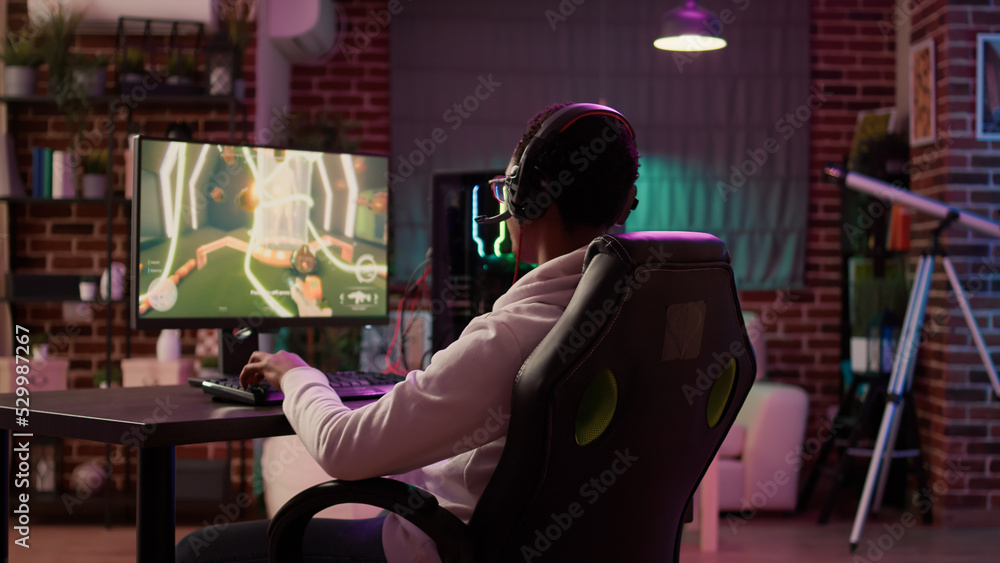 Poster over shoulder view of gamer streaming multiplayer first person shooter angry after losing online com