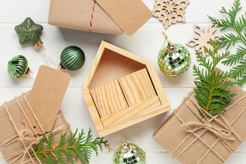 Christmas gift boxes on white wooden background. Xmas concept, preparation for winter holidays.  Top view. Flat lay