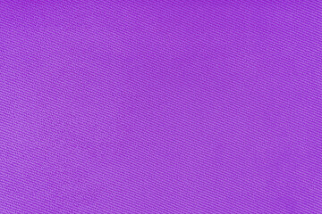 Texture of natural fabric or cloth. Fabric texture diagonal weave of natural cotton or linen textile material. Purple canvas background. Decorative fabric for curtain, furniture, walls, clothes