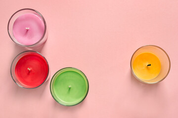 Candles on pink background