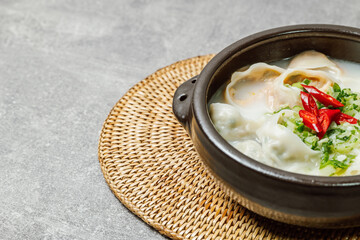 Korean style noodle soup with dumplings, mandu kalguksu