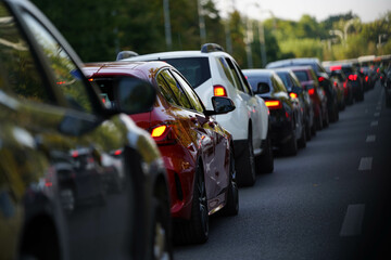 traffic. cars caught in the crowd. photo taken in the evening. people in traffic returning from work.