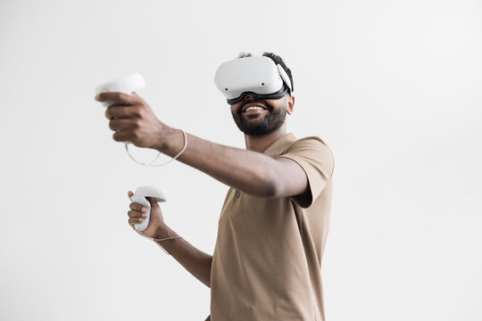 Young man using virtual reality headset at home, VR, future gadgets, technology, virtual event, education, study, learning, video game concept