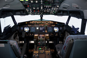 Empty airplane cockpit used by captain and copilot to fly, international airways jet with control...