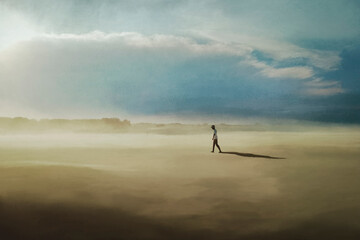 lonely man walks in a desert landscape
