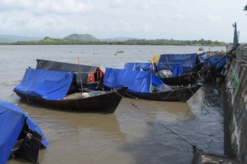 Traditional wooden fishing boats in the port , India